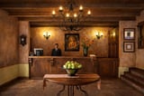 Elegant hotel lobby with wooden reception desk